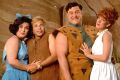 Photograph of Flintstone's family and friends taken millions of years ago. The names of the wives are unknown.